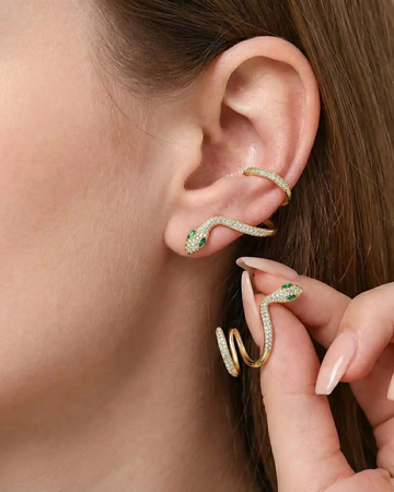 model wearing one gold color moissanite snake climber and holding another one on hand