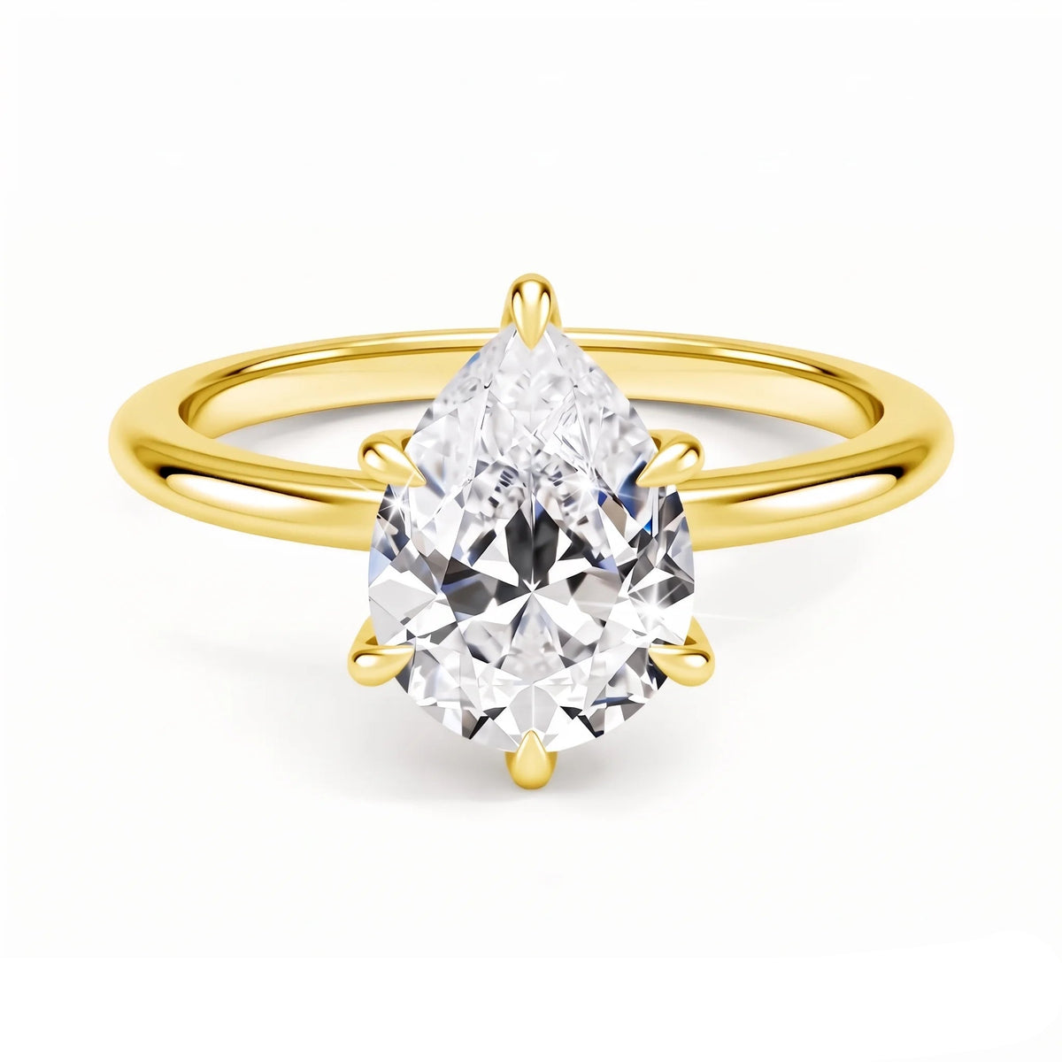 14K gold filled pear cut moissanite engagement ring with a 2ct pear moissanite held in six prongs above a plain slender band - Sensitive Stones