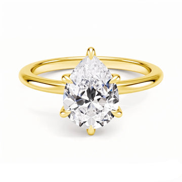 14K gold filled pear cut moissanite engagement ring with a 2ct pear moissanite held in six prongs above a plain slender band - Sensitive Stones