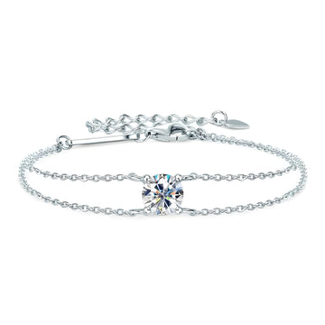 A white gold moissanite solitaire double chain bracelet with a round 1ct D color stone, adjustable lobster clasp and extender chain on a white background - Sensitive Stones