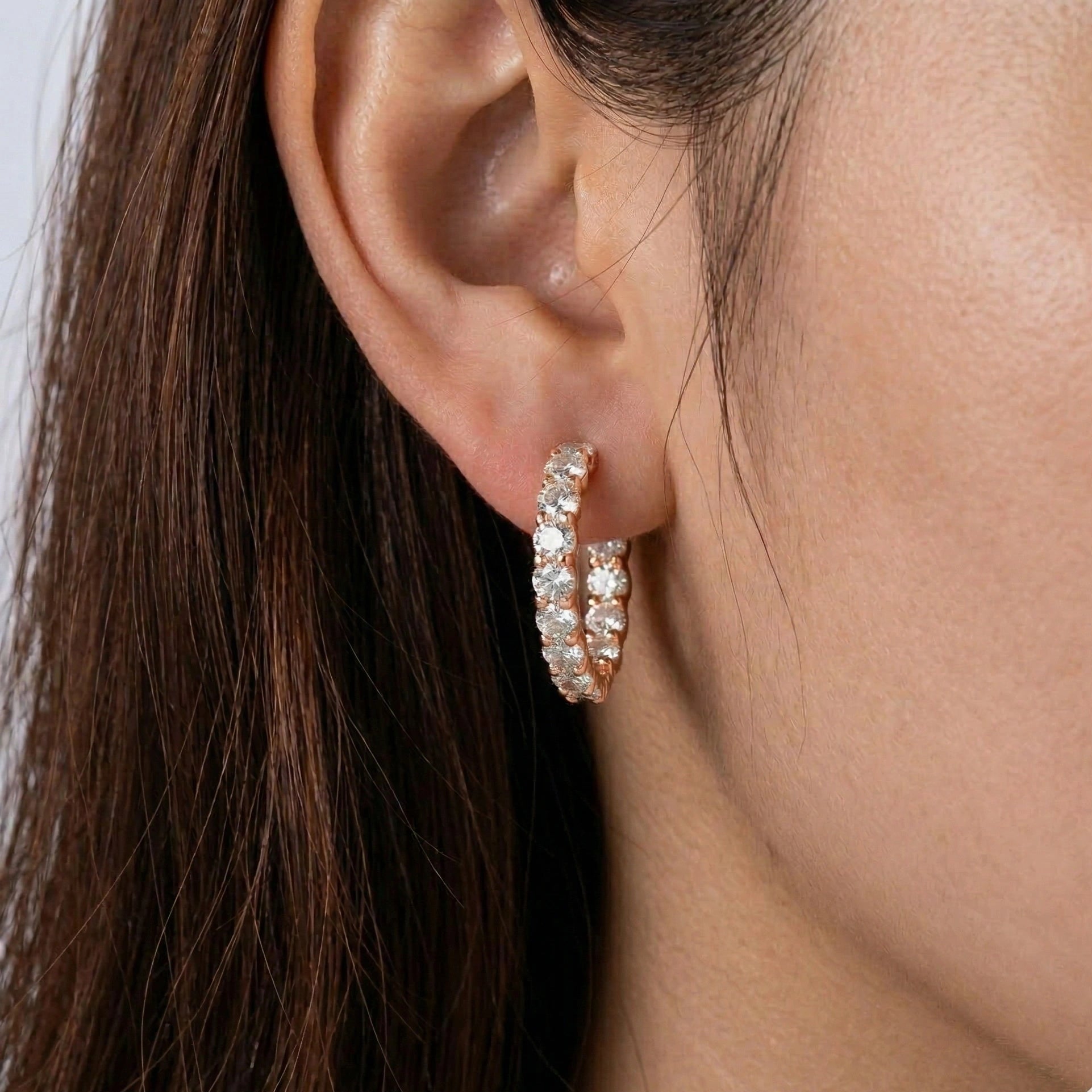 2.6ct moissanite hoop earrings rose gold finish close up on model - Sensitive Stones