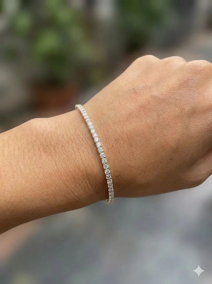 Hand wearing 2.5mm elastic stretch rope moissanite tennis bracelet set in 925 silver with white gold plating - Sensitive Stones