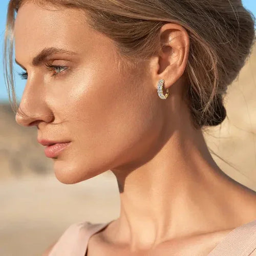 Woman wearing gold moissanite small hoop earrings, outdoor lifestyle close-up – Sensitive Stones