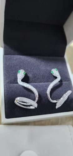 Moissanite snake climber earrings with emerald green eyes, elegantly presented in a jewelry gift box.