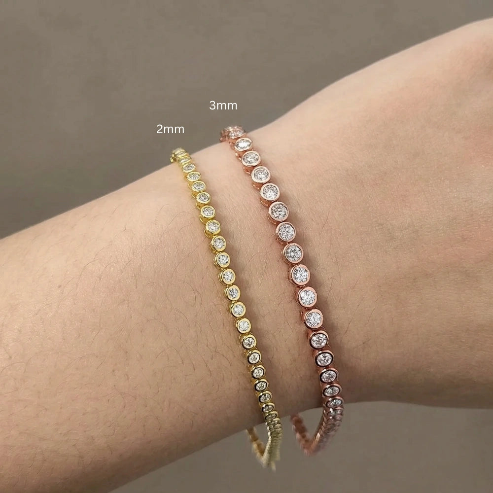 Size comparison of 2mm yellow gold and 3mm rose gold full bezel set moissanite tennis bracelets worn on wrist, 925 sterling silver with 18K plating - Sensitive Stones