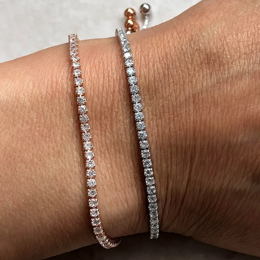 Close-up of 2mm VVS1 moissanite bolo tennis bracelet in rose gold and silver on wrist showing edge-to-edge stone setting - Sensitive Stones