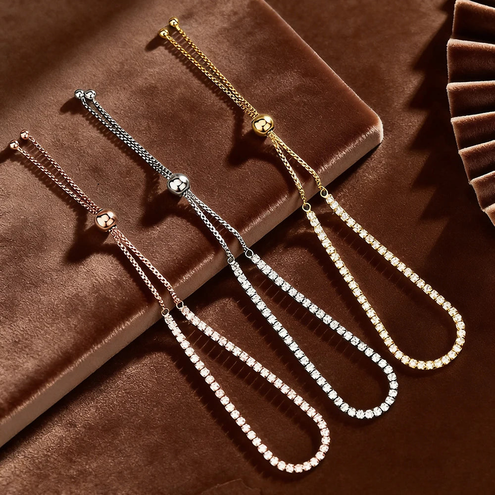 2mm moissanite bolo tennis bracelet in rose gold, silver and yellow gold displayed on brown velvet showing full bolo chain and sparkling stones - Sensitive Stones