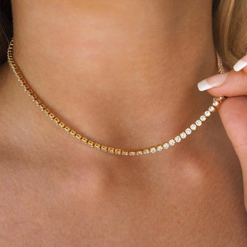 2mm moissanite tennis choker necklace in 18K yellow gold plating held on model neck showing stone coverage - Sensitive Stones