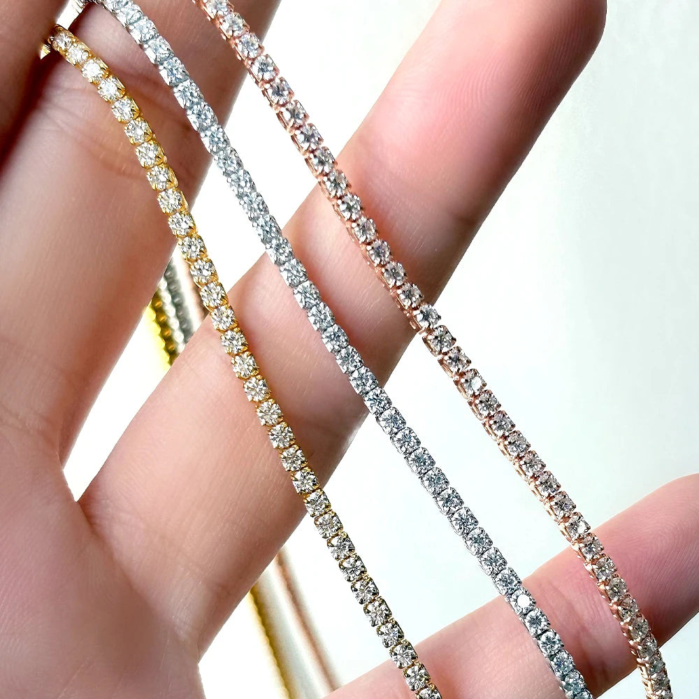 2mm moissanite tennis choker necklace in yellow gold, white gold and rose gold held in hand showing color options - Sensitive Stones