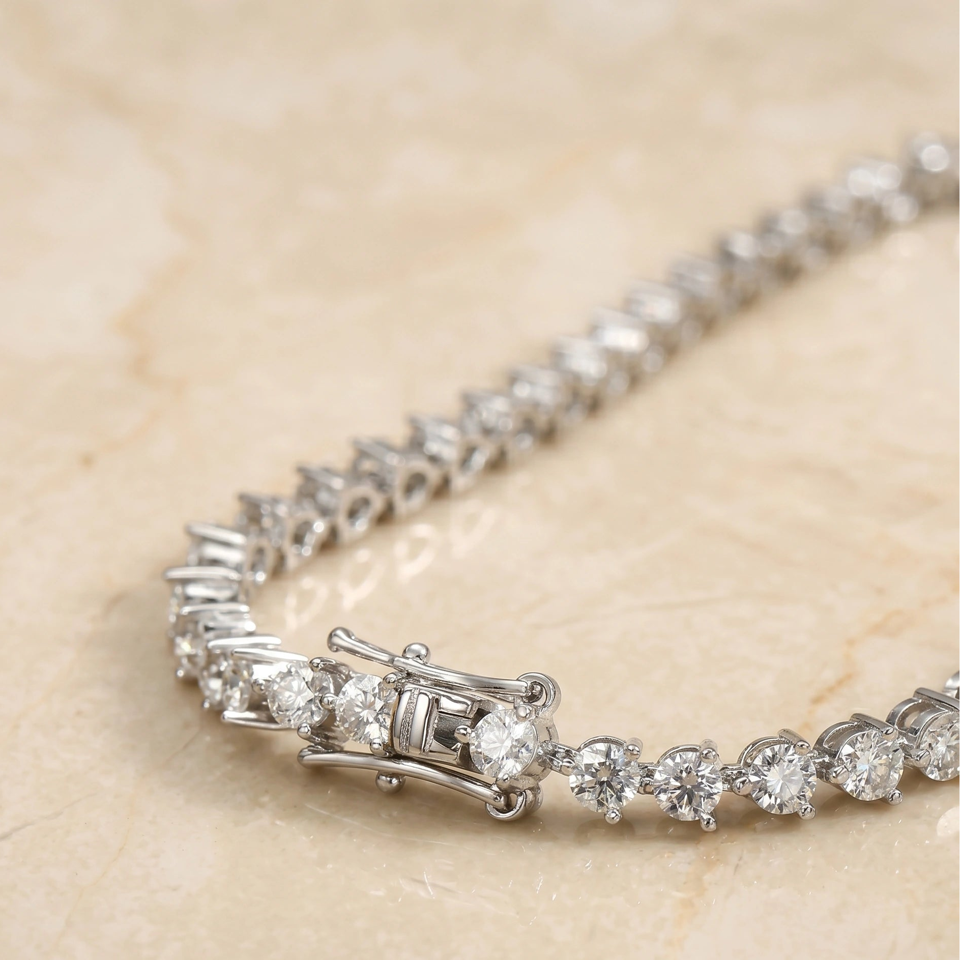 Side view of 3mm moissanite tennis bracelet clasp and stone alignment in sterling silver - Sensitive Stones