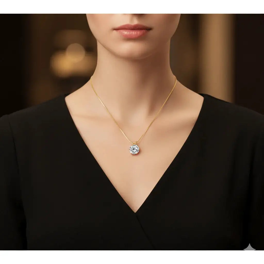 Woman wearing 3ct moissanite solitaire necklace in 18K yellow gold plating, styled with elegant black V-neck dress – Sensitive Stones