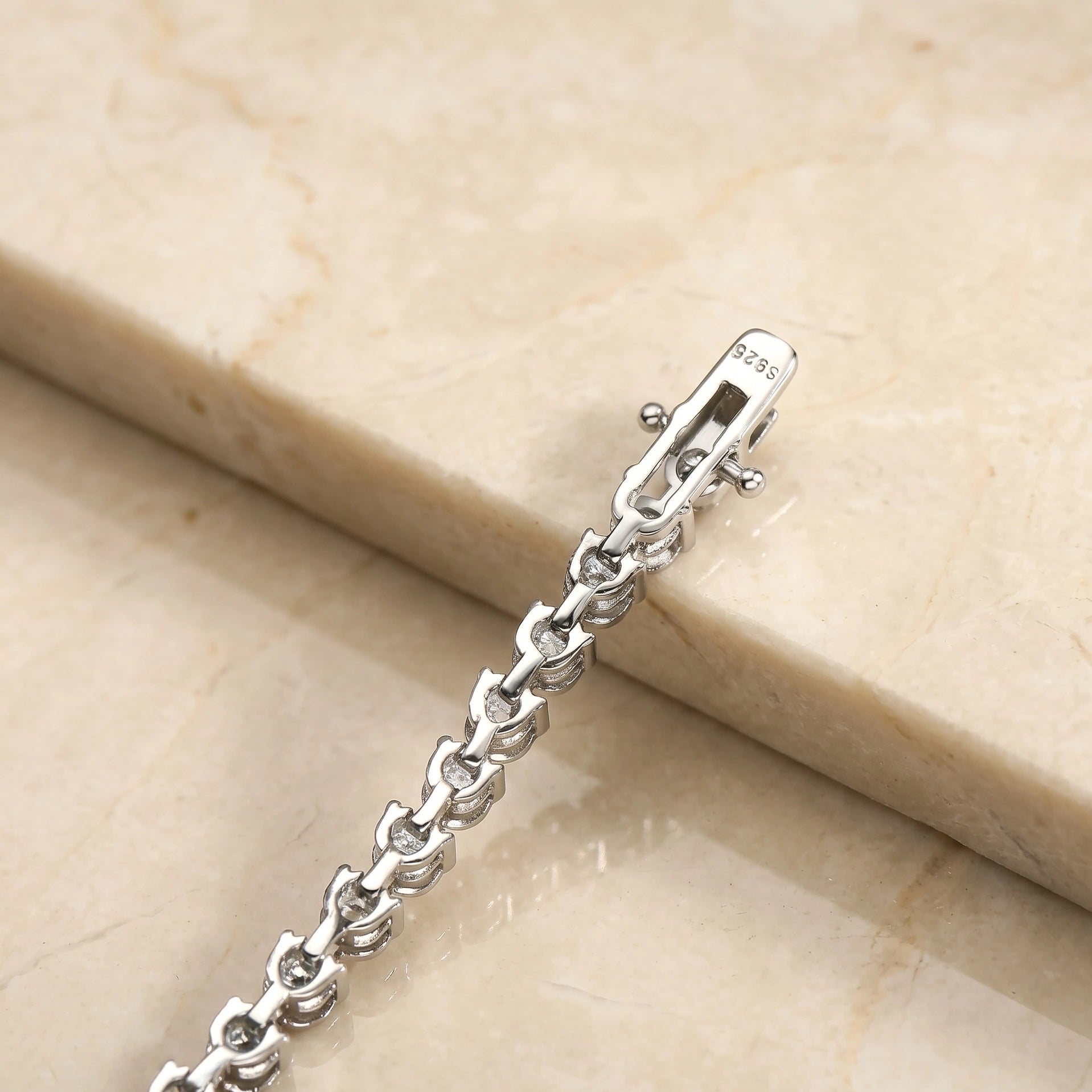 Backside of 3mm 3-prong moissanite tennis bracelet showing 925 sterling silver stamp and clasp design - Sensitive Stones