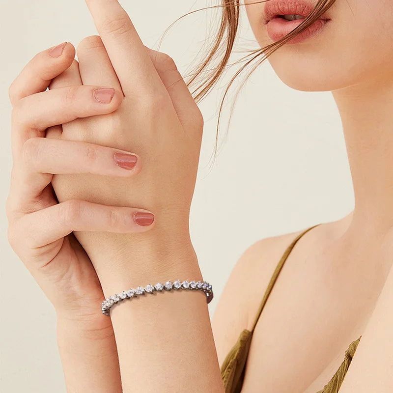 Model wearing a 3mm 3-prong set white moissanite tennis bracelet in sterling silver, showcasing delicate brilliance and timeless quiet luxury - Sensitive Stones