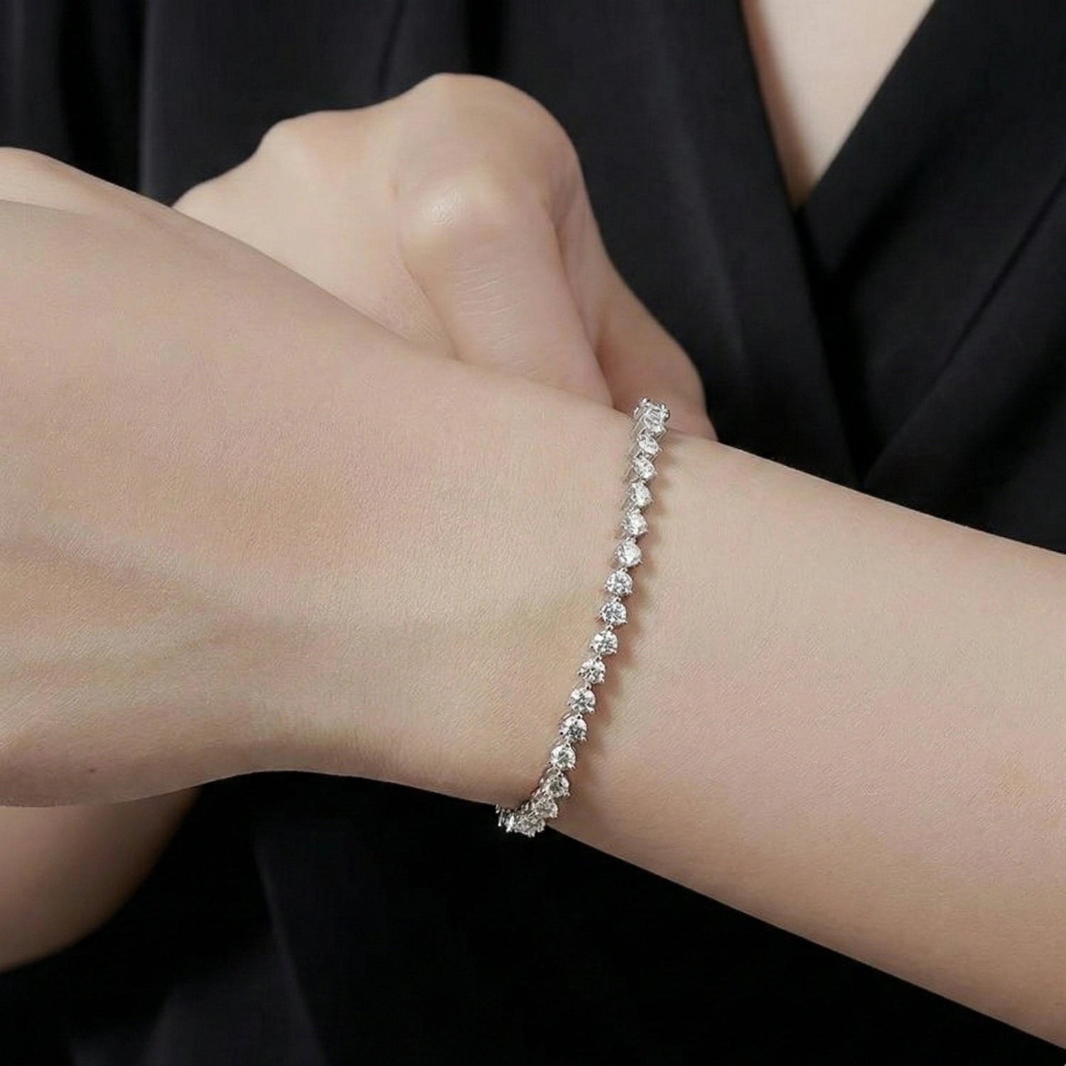 Model wearing a 3mm 3-claw set white moissanite tennis bracelet in sterling silver, showcasing delicate brilliance and timeless quiet luxury - Sensitive Stones