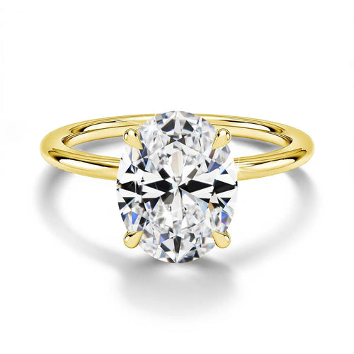 4-prong oval cut moissanite engagement ring in 14K gold filled with a D color VVS1 stone