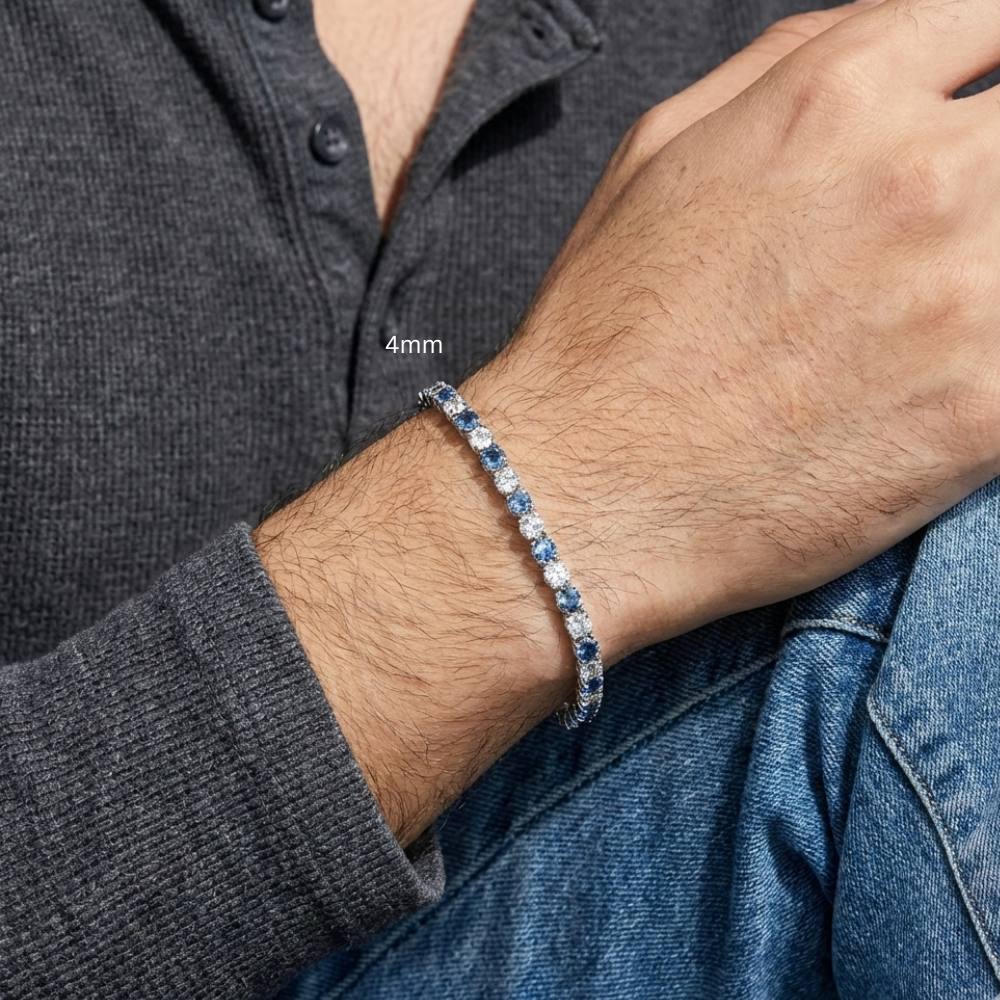 Man wearing 4mm alternating blue and white moissanite tennis bracelet 925 sterling silver round-cut stones casual lifestyle - Sensitive Stones