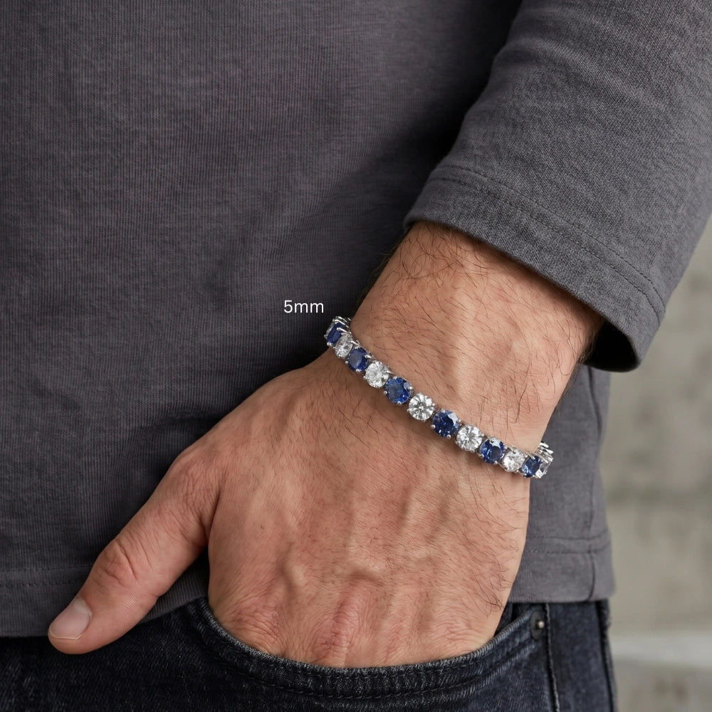 Man wearing 5mm alternating blue and white moissanite tennis bracelet 925 sterling silver round-cut stones casual lifestyle - Sensitive Stones