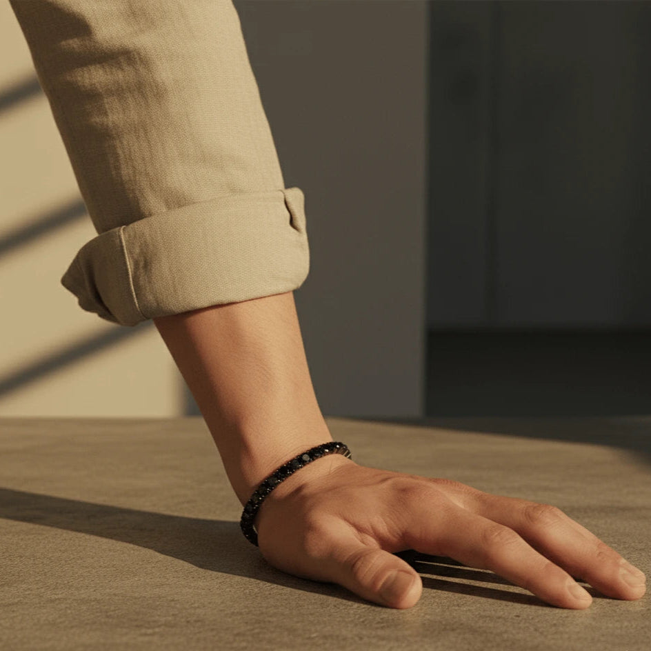 5mm black moissanite tennis bracelet for men, black gold plated, masculine wrist in warm natural sunlight – Sensitive Stones