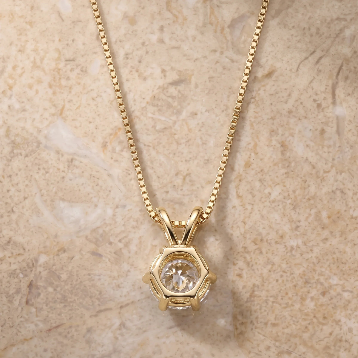 Back of the 6-prong moissanite solitaire pendant in a yellow gold finish showing the solid six-claw basket and the double bail - Sensitive Stones