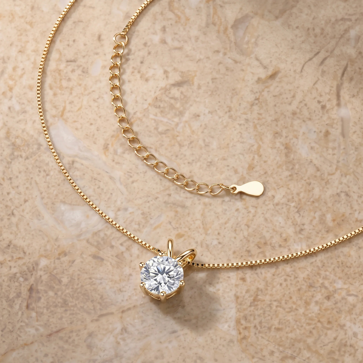 6-prong moissanite solitaire necklace in a yellow gold finish showing the box chain and the adjustable extender - Sensitive Stones