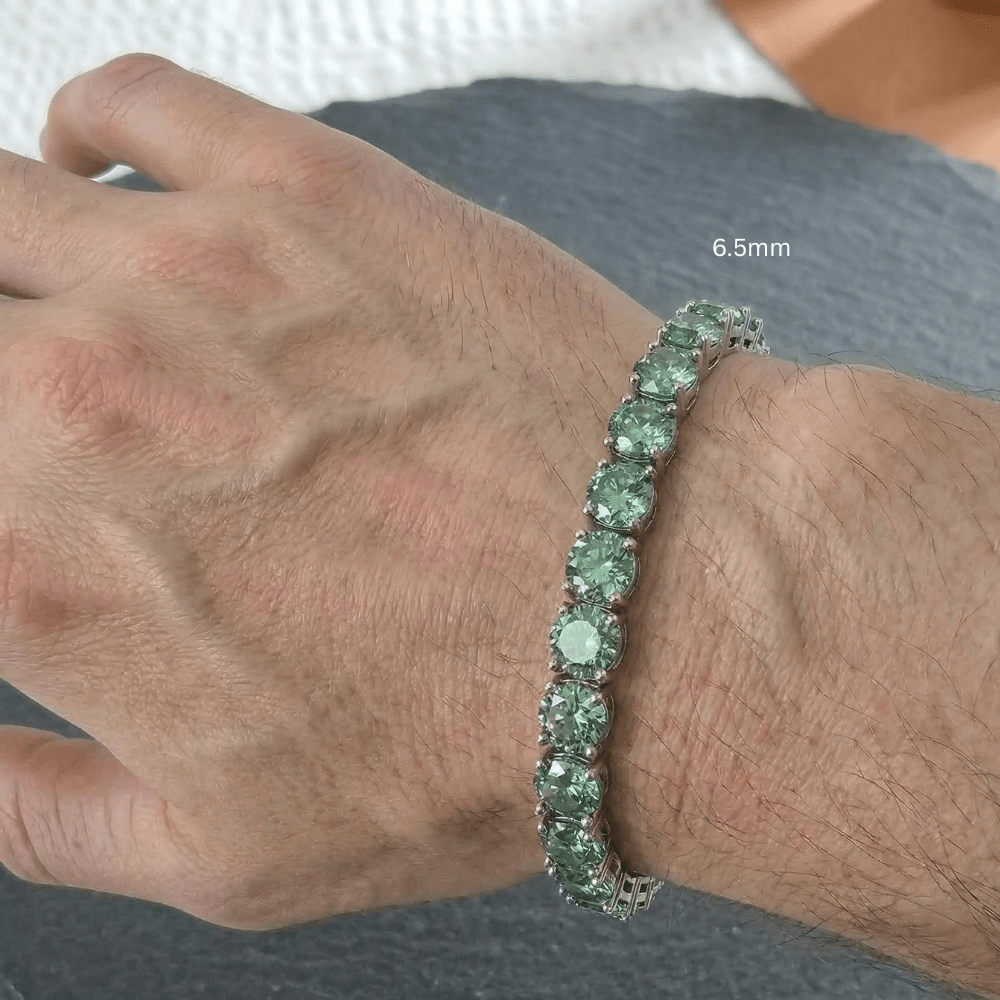6.5mm green moissanite tennis bracelet worn on wrist in 925 sterling silver with white gold plating on a man's wrist - Sensitive Stones
