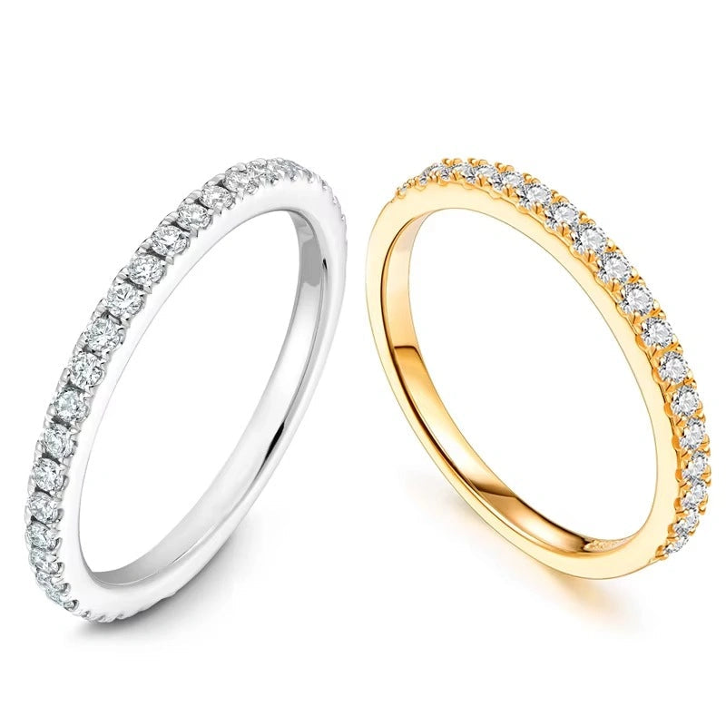 Angled view showing brilliance of 18K white gold and yellow gold plated silver moissanite ring in a half eternity band design  - Sensitive Stones