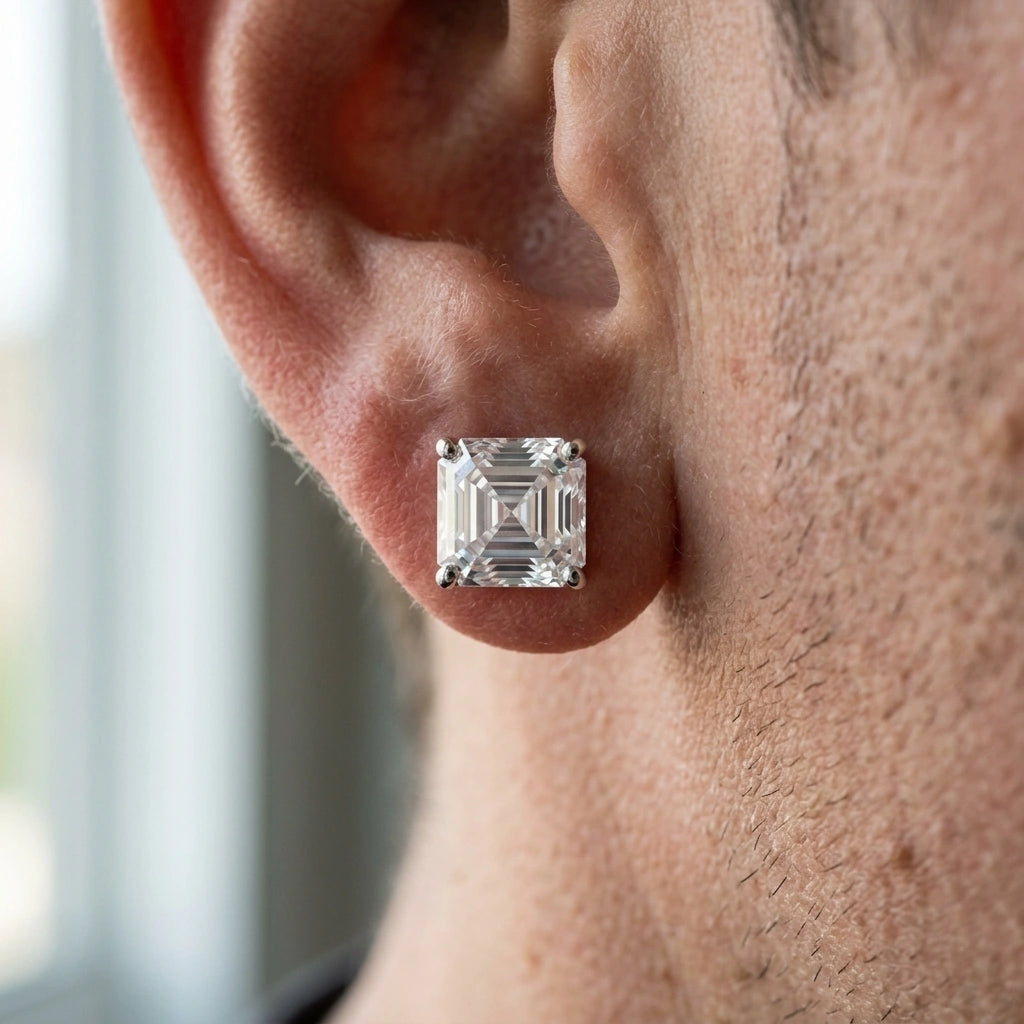 Man wearing a 2ct asscher cut moissanite stud earring in white gold, macro close up of the square step cut - Sensitive Stones