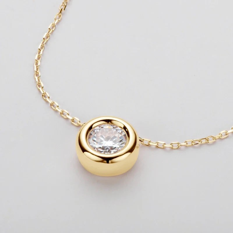 Close up of bezel set moissanite pendant necklace in 18K gold plating with O-chain - Sensitive Stones
