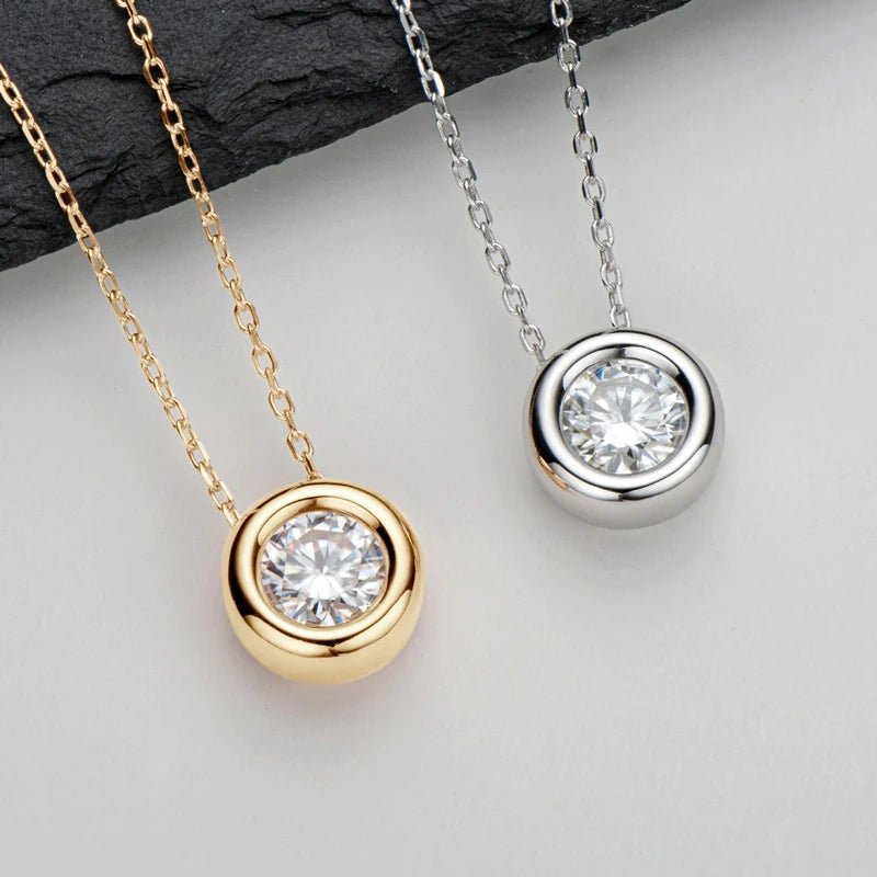 Bezel moissanite pendant necklace in 18K gold and 925 sterling silver side by side - Sensitive Stones