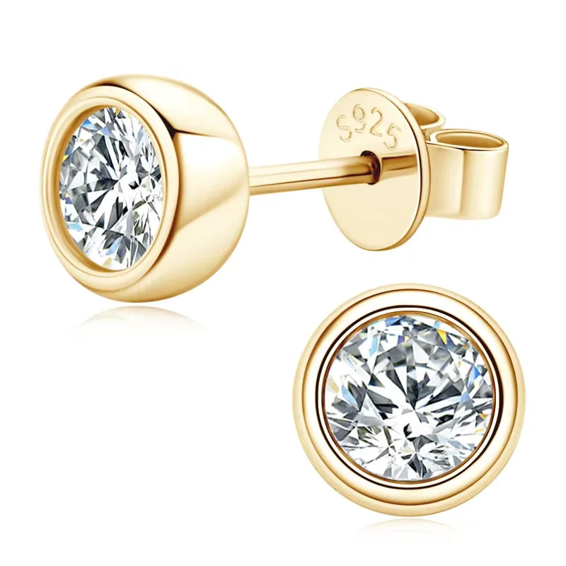 Bezel set moissanite stud earrings in 925 sterling silver with a yellow gold finish showing side profile and top view - Sensitive Stones