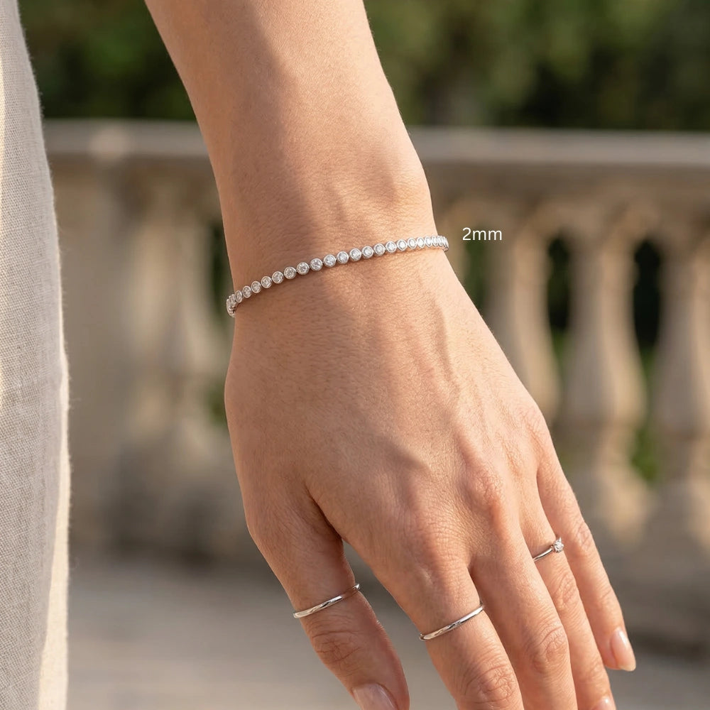 2mm bezel moissanite tennis bracelet on wrist silver delicate everyday jewelry - Sensitive Stones