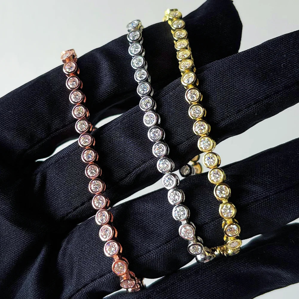 Hand holding 3 bezel moissanite tennis bracelet with 3mm D color VVS1 stones and secure double safety clasp in solid 925 sterling silver, white gold, yellow gold and rose gold plating - Sensitive Stones