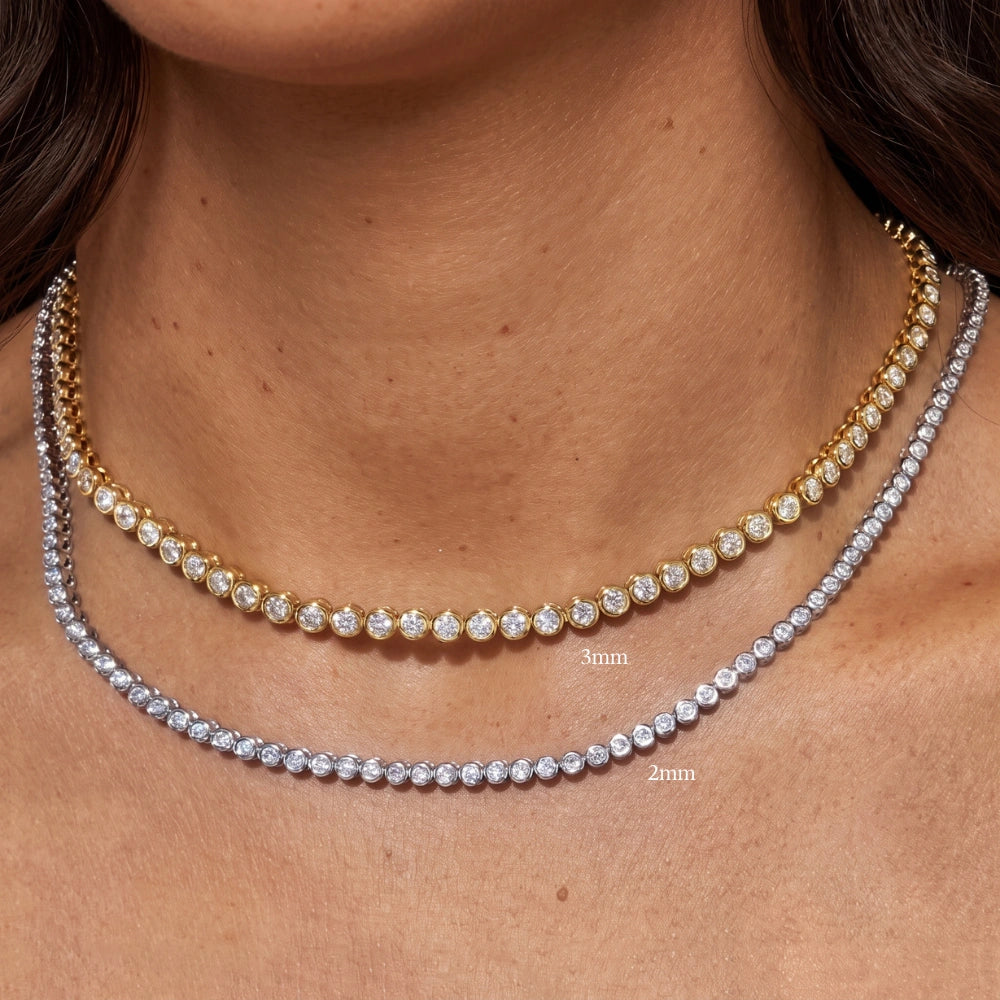 Bezel moissanite tennis necklace size comparison showing 3mm in yellow gold above 2mm in white gold on the neck