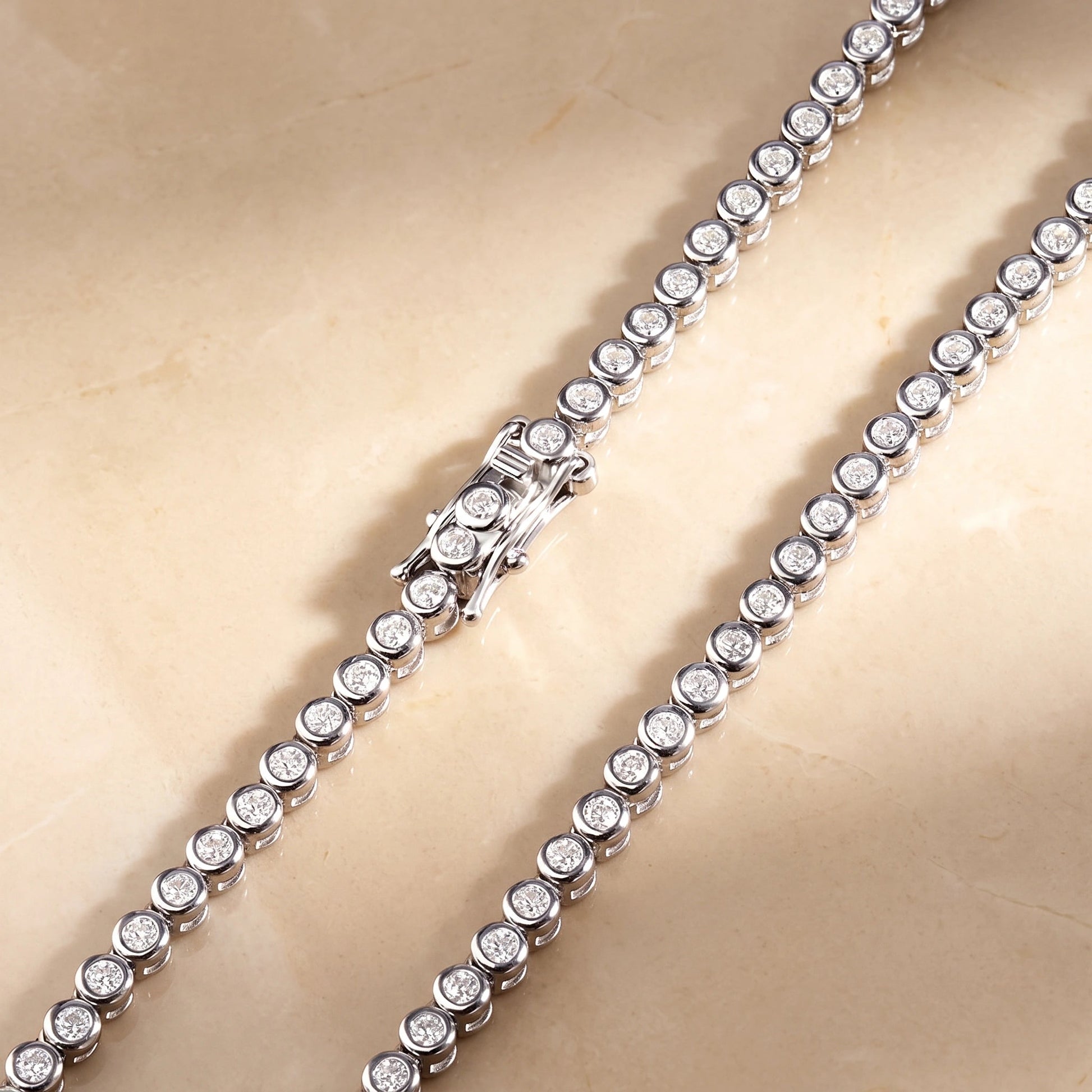 Close-up of the box clasp with double safety catch on a bezel moissanite tennis necklace in 925 sterling silver