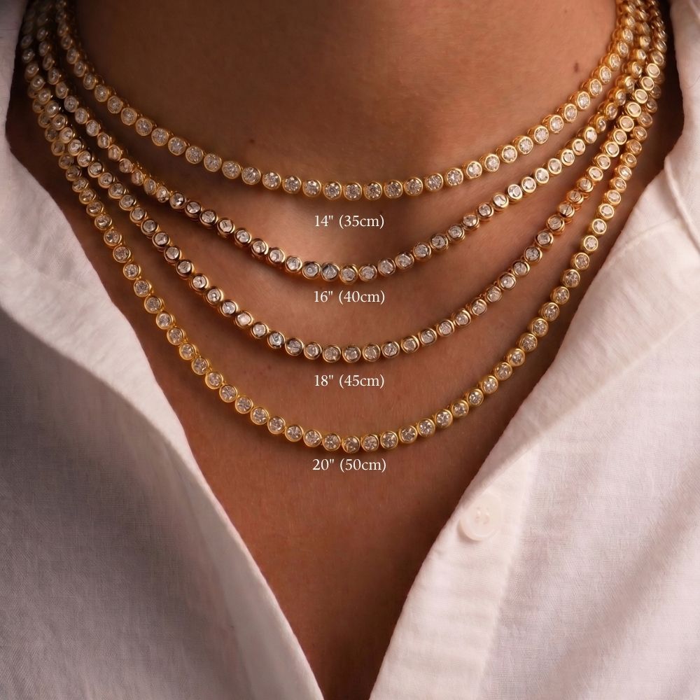 Bezel moissanite tennis necklace length guide showing 14in, 16in, 18in and 20in worn layered on the neck in 18K yellow gold plated 925 sterling silver