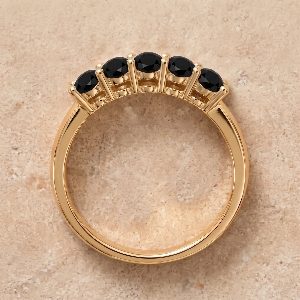 Front view of the black moissanite five stone stackable ring in 14K gold filled, showing the shared prong setting and low band profile - Sensitive Stones