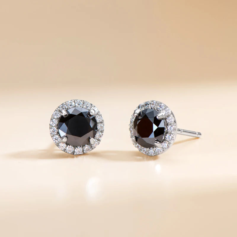 Black moissanite halo stud earrings in 925 sterling silver with cubic zirconia accent halo and butterfly backs close up view - Sensitive Stones