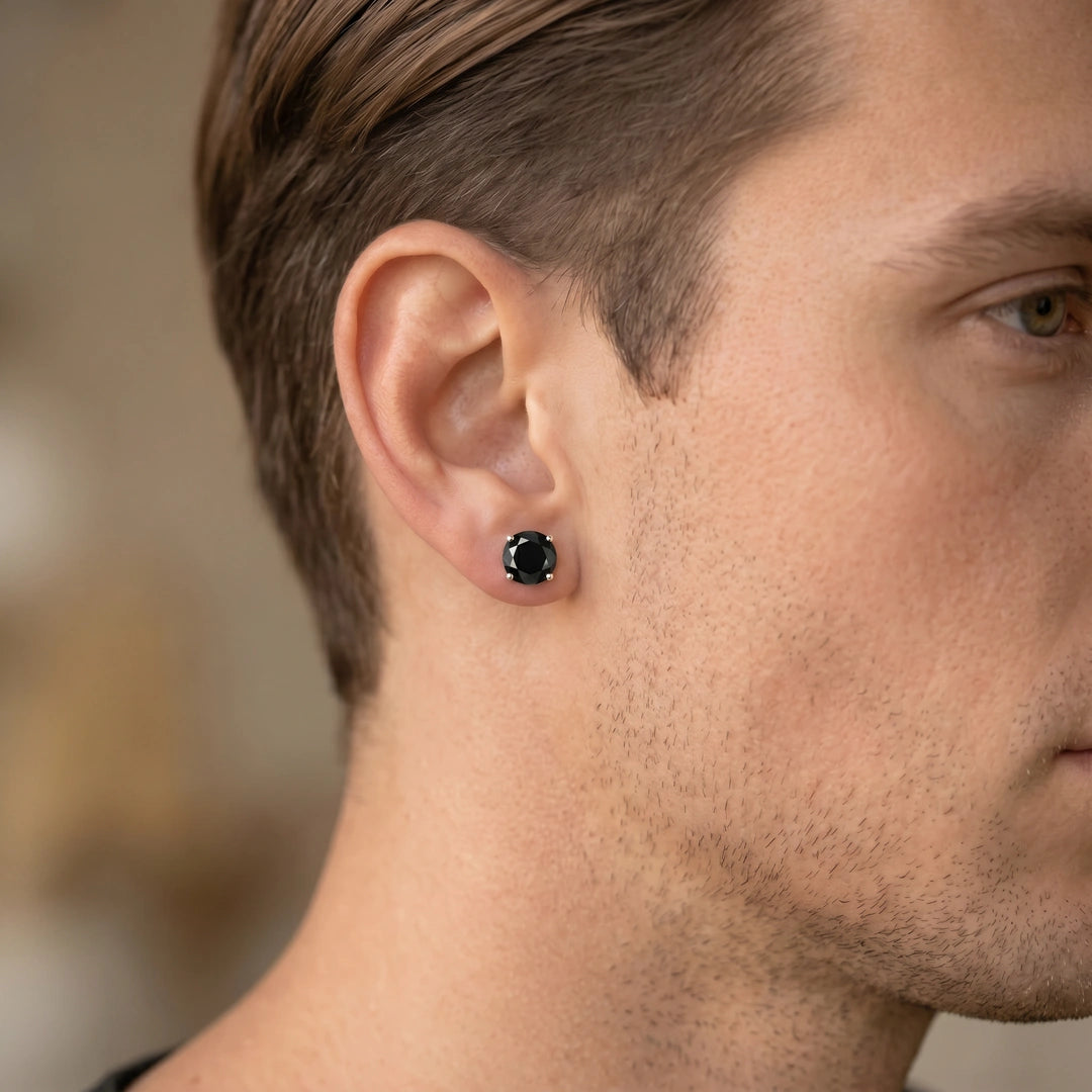 Man wearing a black moissanite stud earring, round cut 4-prong silver setting - Sensitive Stones