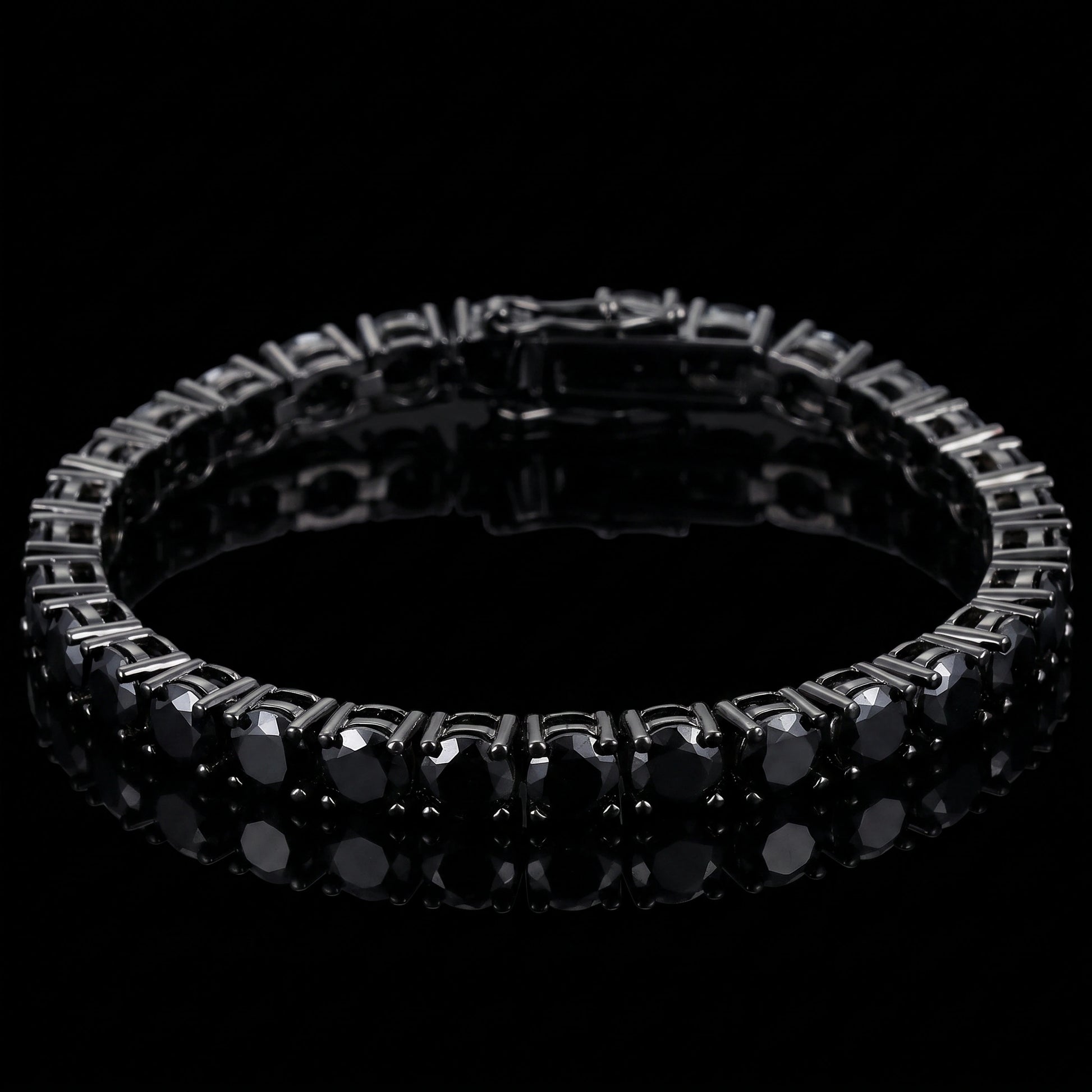 A 5mm black moissanite tennis bracelet with  set in 925 sterling silver with black gold finish, displayed on a reflective black surface against a black background - Sensitive Stones