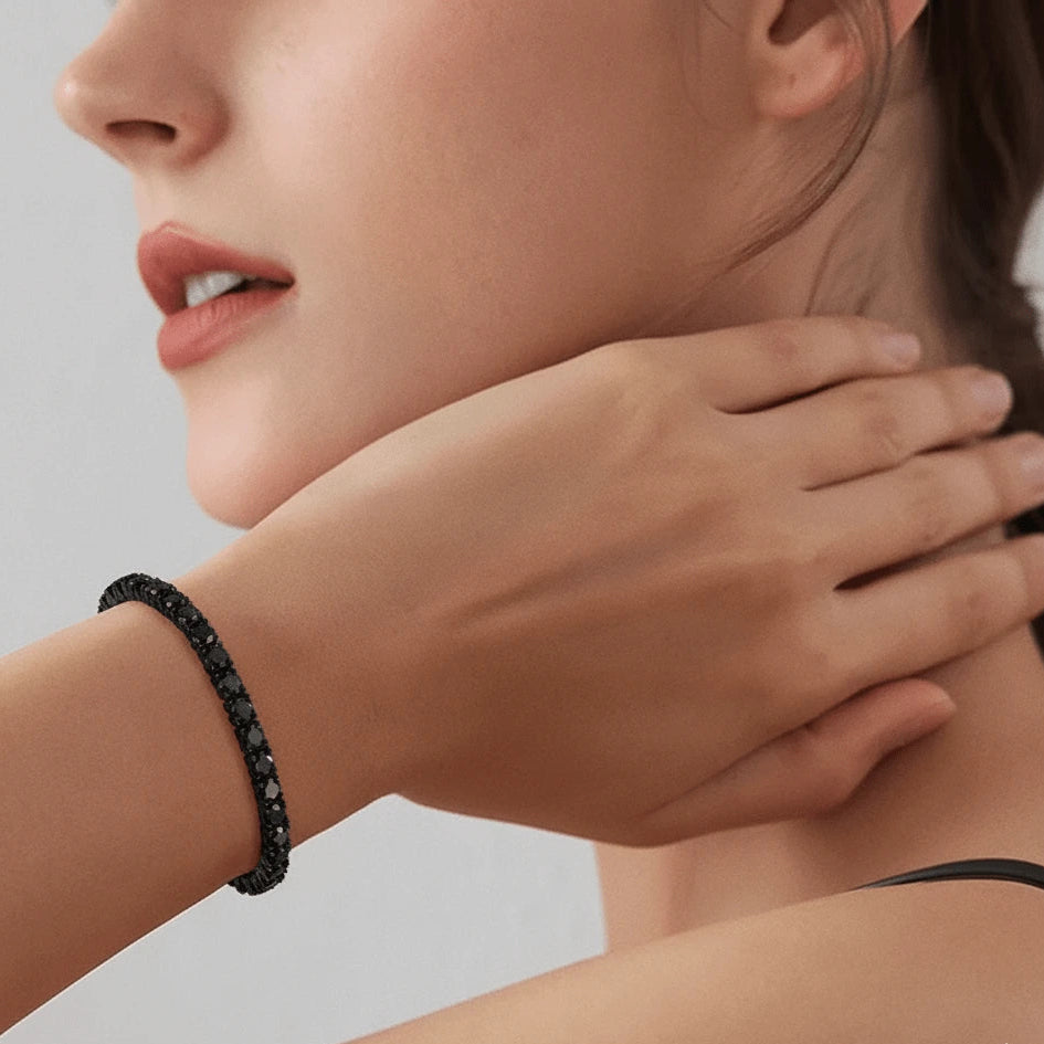 Woman wearing 4mm black moissanite tennis bracelet, 925 sterling silver setting, elegant close-up – Sensitive Stones