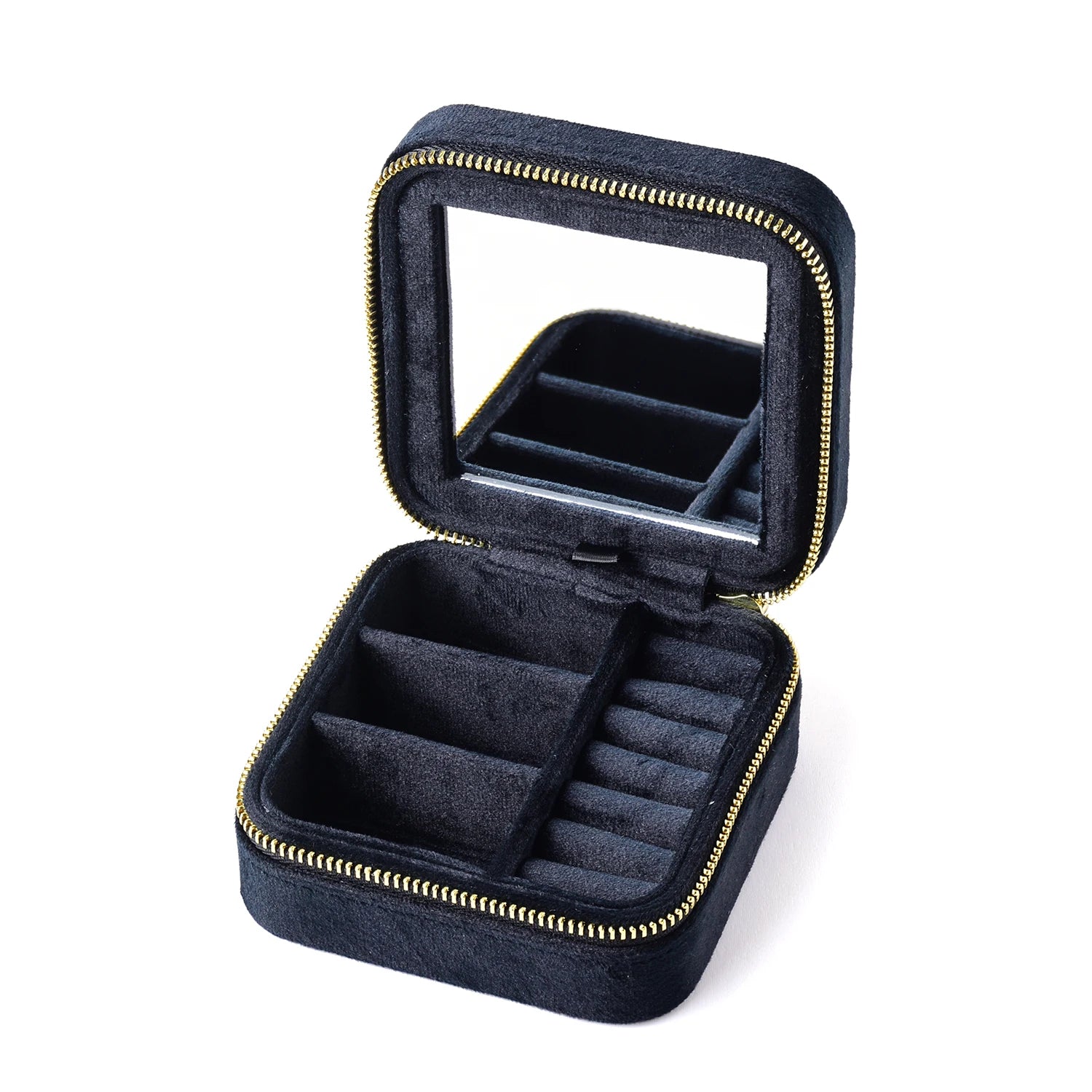 Black velvet travel jewelry box open showing ring rolls and earring compartments with built-in mirror - Sensitive Stones