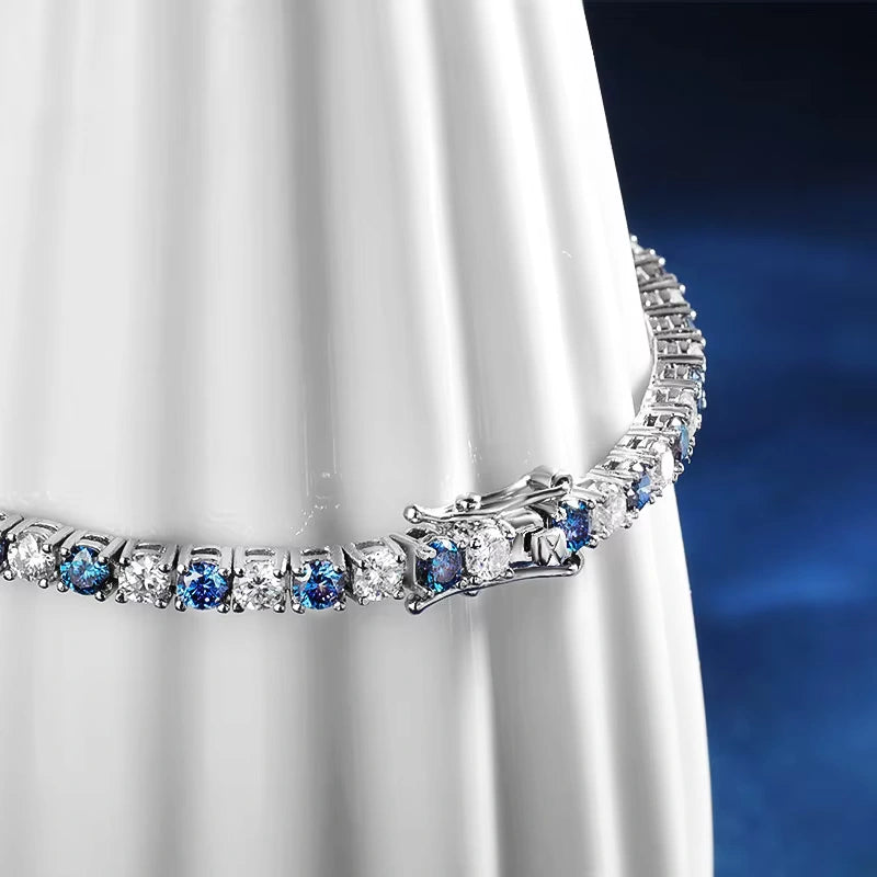 Detailed view of clasp and stones on Blue Moissanite Tennis Bracelet, featuring alternating blue and white moissanite gems in prong setting, crafted in sterling silver with 18K white gold finish - Sensitive Stones