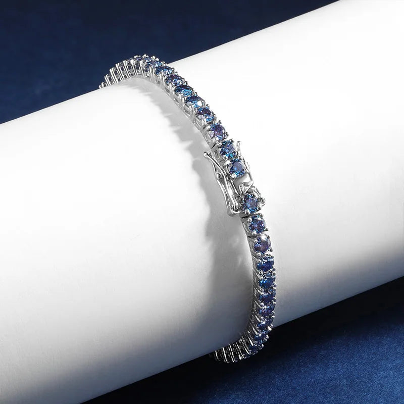 Close up view of clasp and stones on Blue Moissanite Tennis Bracelet in prong setting, crafted in sterling silver with 18K white gold finish - Sensitive Stones