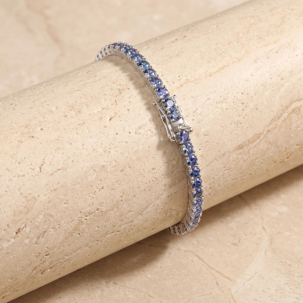 Close-up of the box clasp on a full blue moissanite tennis bracelet, color-shifting round-cut stones in 925 sterling silver 18K white gold - Sensitive Stones