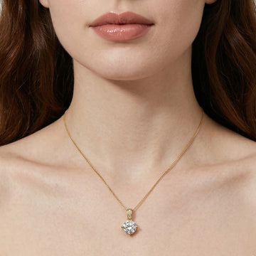 Woman wearing Celeste 4-prong moissanite solitaire necklace in 18K gold plated sterling silver with pavé bail on box chain - Sensitive Stones