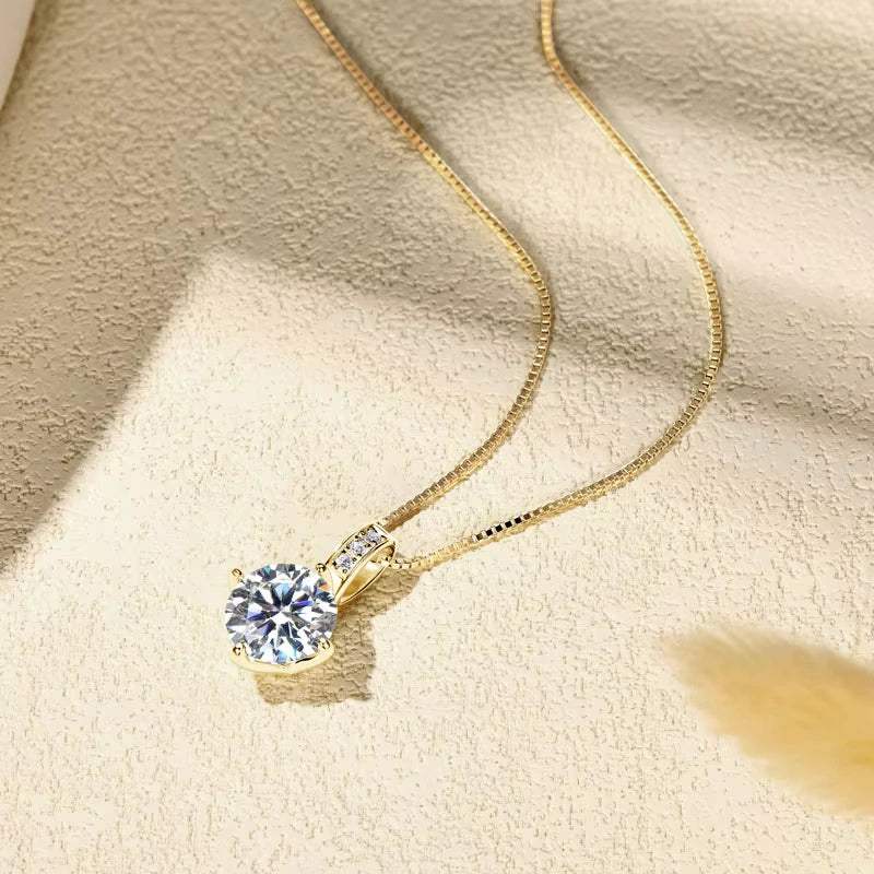 Celeste pavé moissanite solitaire necklace in 18K gold plating lifestyle flat lay on textured surface - Sensitive Stones