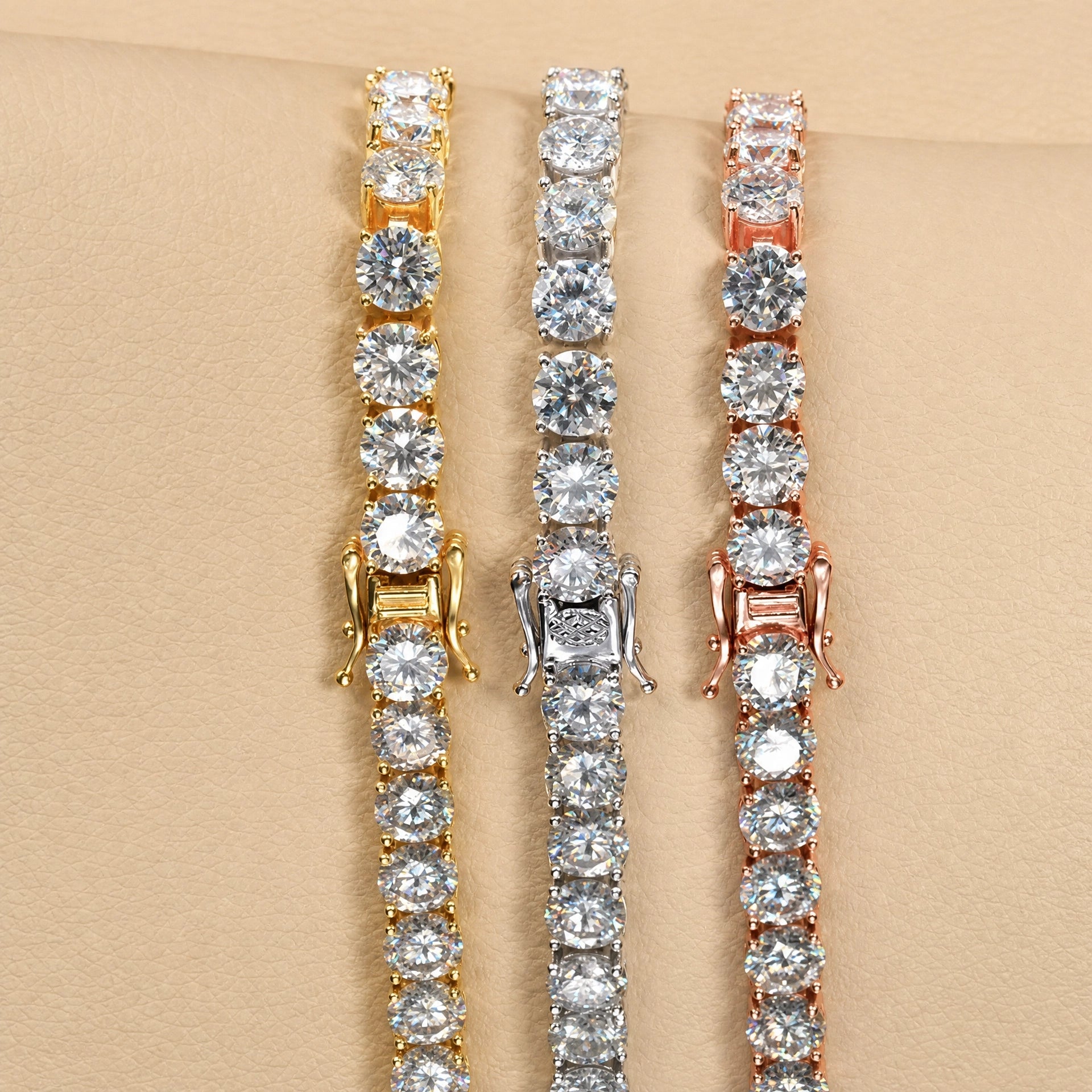 Classic moissanite tennis bracelet in 18K yellow gold, white gold and rose gold side by side, showing the box clasp and claw set round D Color VVS1 stones - Sensitive Stones