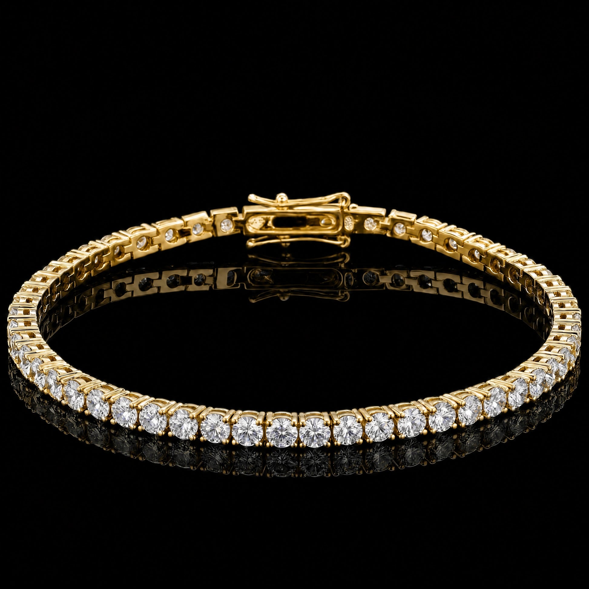 A 3mm classic moissanite tennis bracelet with clear round-cut stones set in 925 sterling silver with yellow gold finish, featuring a central clasp, displayed on a reflective black surface against a black background - Sensitive Stones