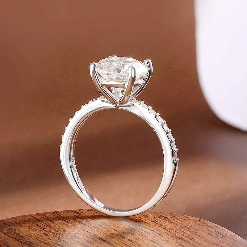 Close-up of 2-carat D-Color Moissanite Engagement Ring – solitaire round cut with pavé CZ band, 925 silver – Sensitive Stones