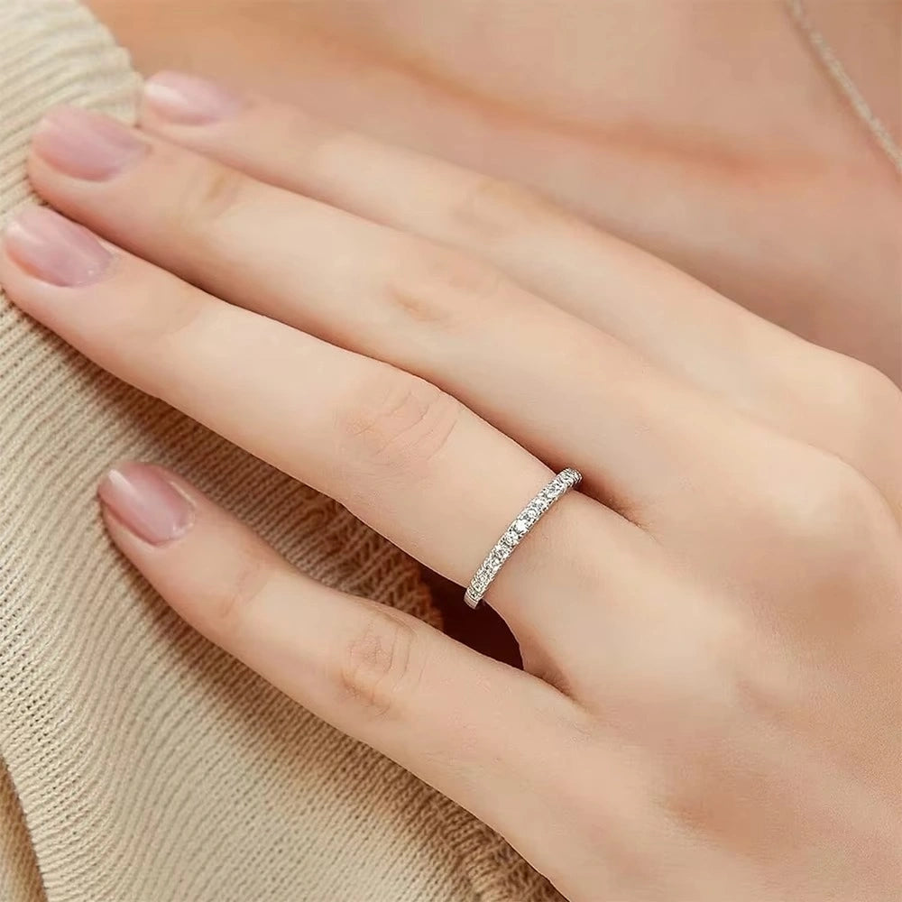 Close-up of a hand wearing a moissanite ring set in 925 sterling silver - Sensitive Stones